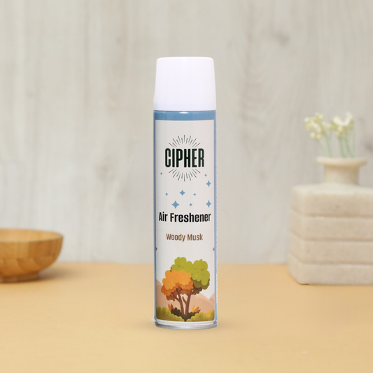 Premium Air Freshener Woody Musk 230ml bottle. The air freshener promises a balanced fusion of woody and musky notes, suitable for use on linens with a non-staining formula